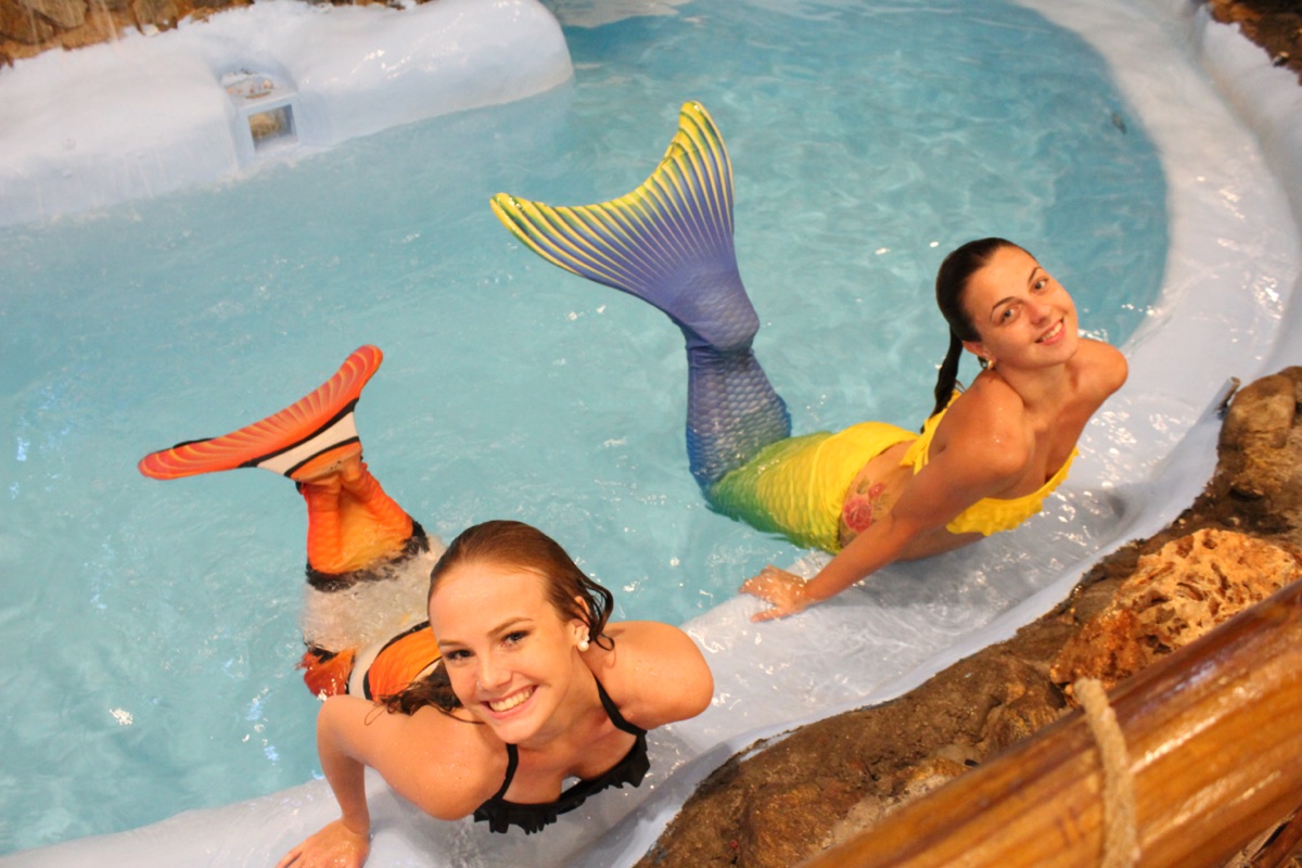 Live mermaids at Pirate's Table's indoor lagoon